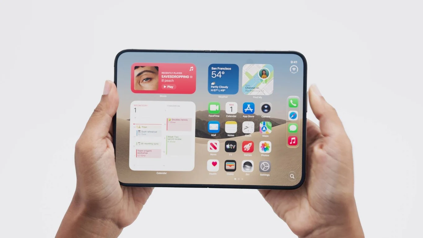 Dwie dłonie trzymają nowoczesny tablet z wyświetlaczem uruchomionym na ekranie głównym, na którym widoczne są kolorowe ikony aplikacji oraz widżety pogodowe i informacyjne.
