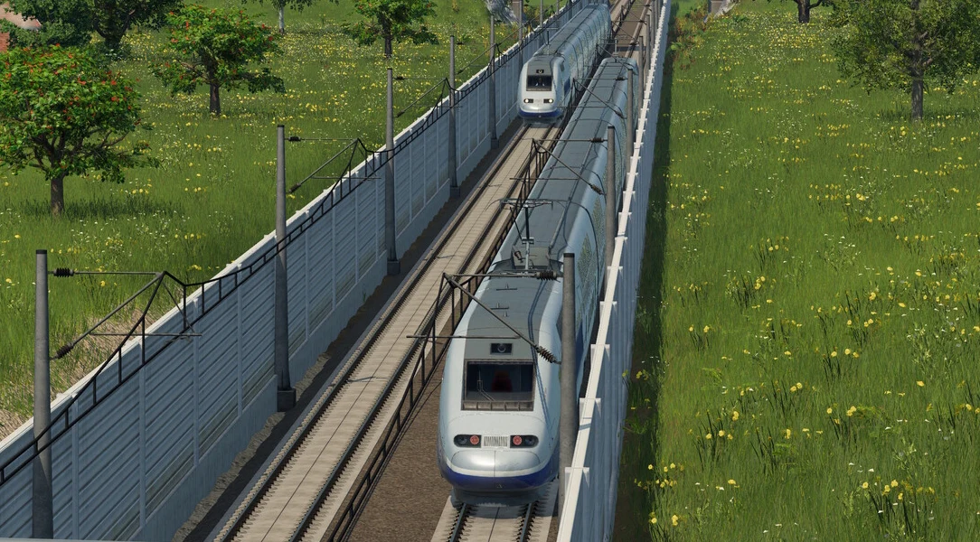 Transport Fever 3 Dwa nowoczesne pociągi dużych prędkości mijają się na równoległych torach przy ekranach dźwiękochłonnych.