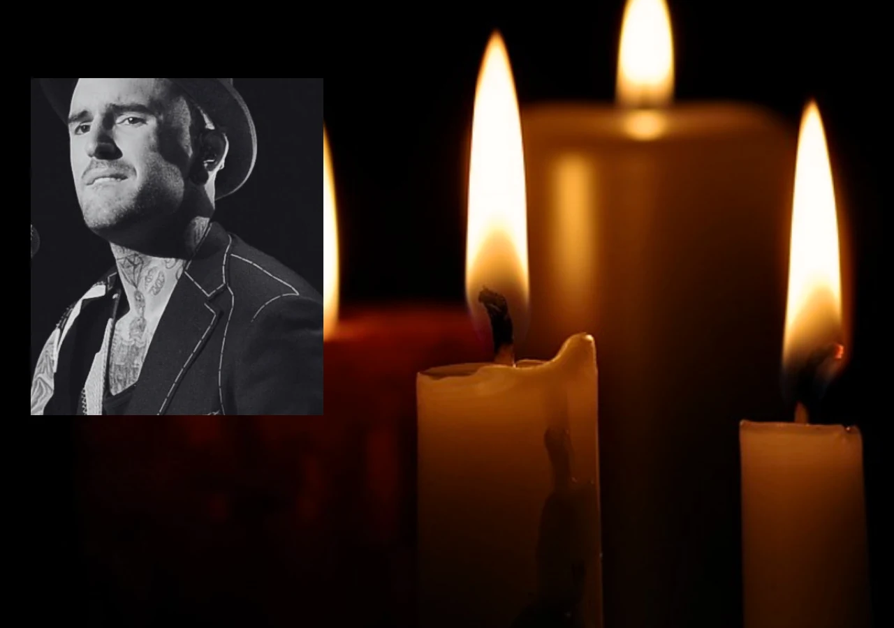 Nie żyje Ben Saunders Czarno-biały portret mężczyzny z tatuażami i kapeluszem, zestawiony z trzema zapalonymi świecami na ciemnym tle.