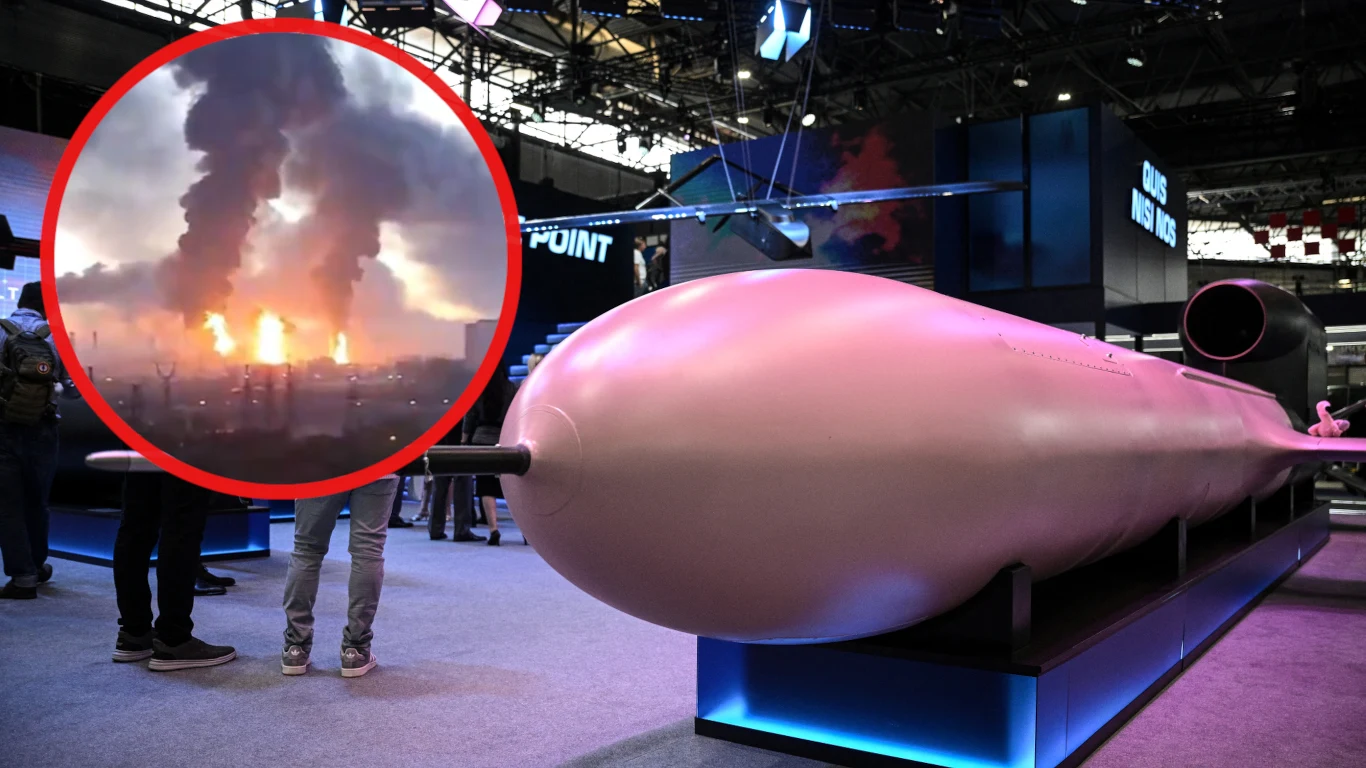 Ukraińcy po raz pierwszy posłali na Moskwę swój najcięższy pocisk FP-5 Flamingo Model okrętu podwodnego na targach, sylwetki osób, w rogu zdjęcie pożaru i dym nad miastem.