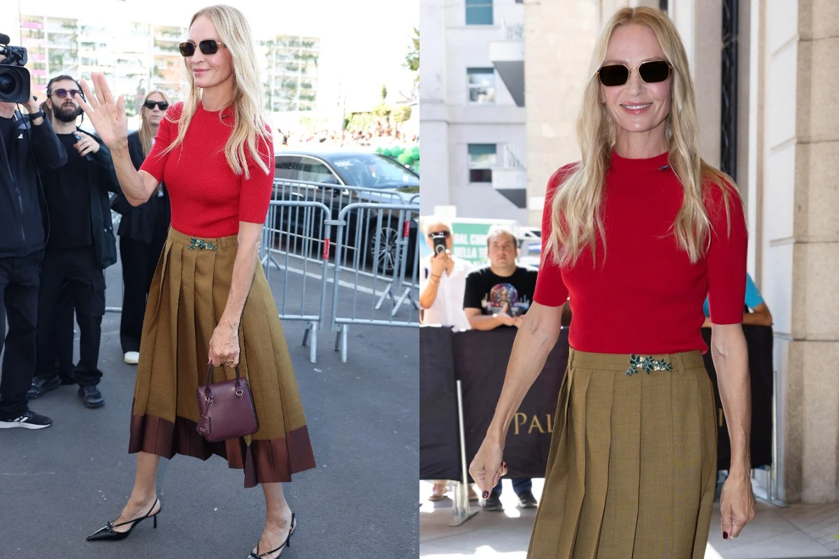 Uma Thurman zachwyca stylem na pokazie Prady Uma Thurman w czerwonym topie, plisowanej spódnicy i czarnych okularach na pokazie Prady, z brązową torebką.