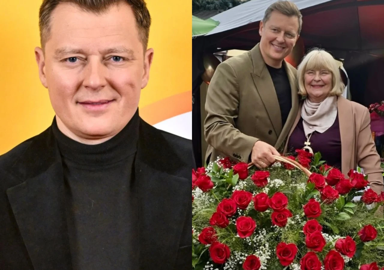Rafał Brzozowski z mamą Grażyną Uśmiechnięty mężczyzna w eleganckiej marynarce oraz starsza kobieta stojący razem przy dużym koszu pełnym czerwonych róż.