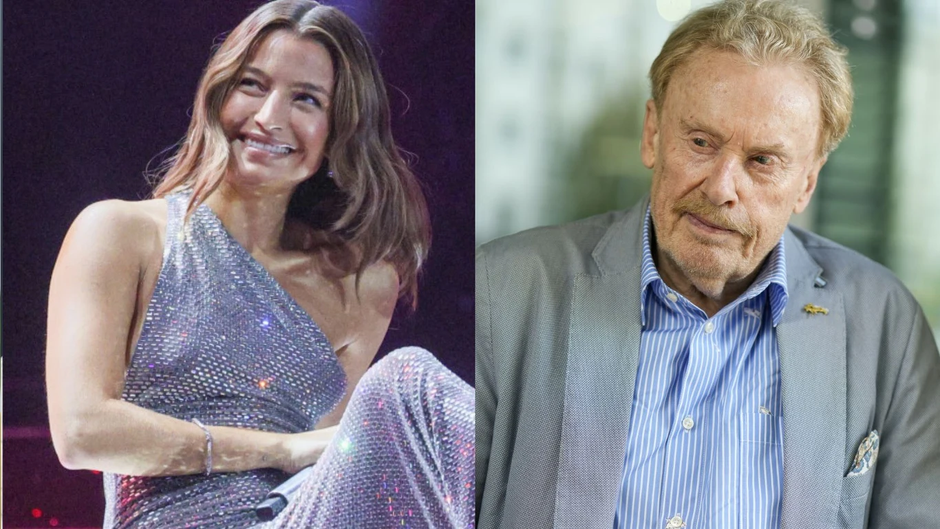Julia Wieniawa i Daniel Olbrychski Julia Wieniawa w srebrnej sukni oraz Daniel Olbrychski siedzą obok siebie.
