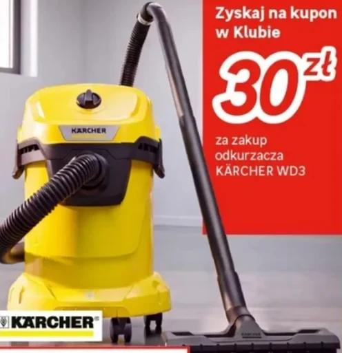 Żółty odkurzacz przemysłowy Karcher WD3 ustawiony na jasnej podłodze, obok informacja o promocji z kuponem o wartości 30 zł za zakup urządzenia.