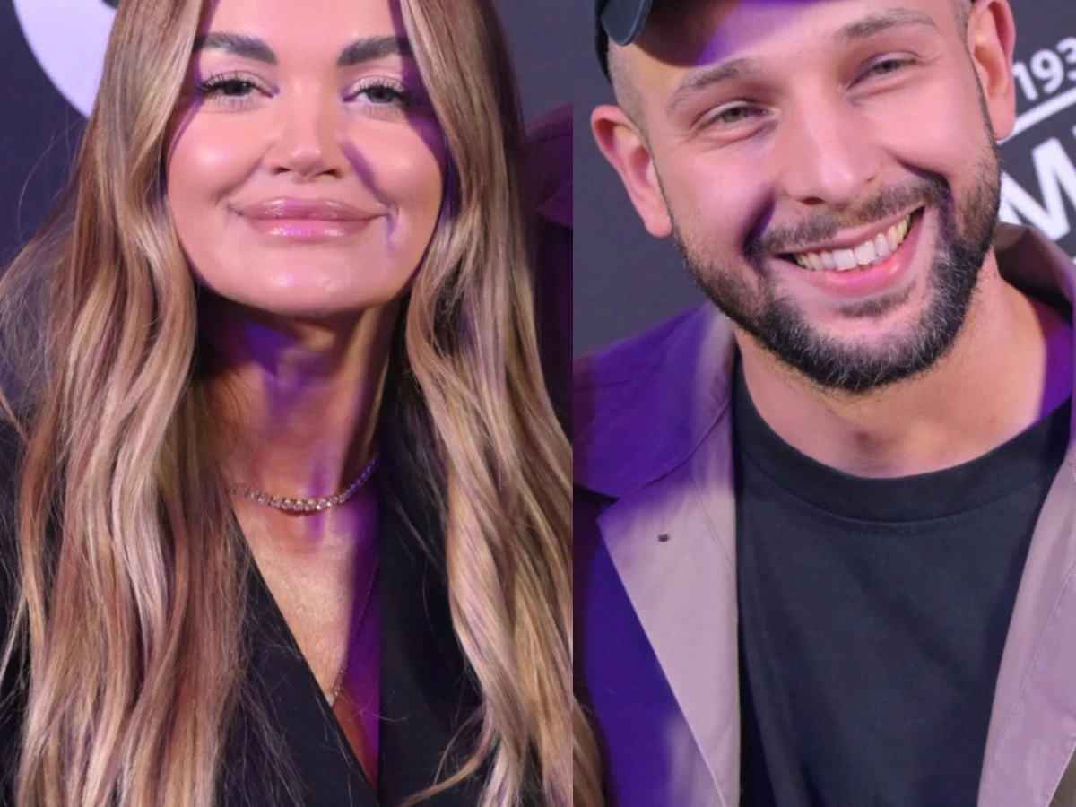 Edyta Folwarska, Maciej Pela Edyta Folwarska i Maciej Pela uśmiechnięci podczas wspólnego wyjścia na tle ścianki z logotypami.
