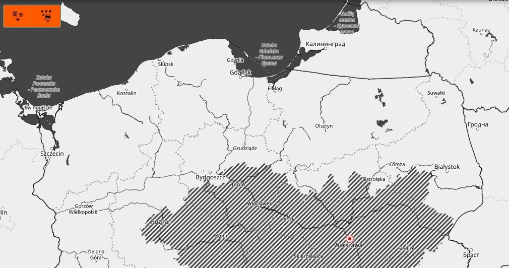 Alerty IMGW drugiego stopnia dotyczące intensywnych opadów śniegu wydano dla województw podkarpackiego i małopolskiego. Zakreskowany obszar t strefa występowania mgieł /IMGW /