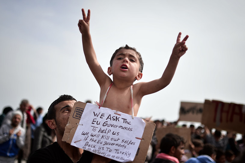 Będą kary za nieprzyjęcie uchodźców? /AFP