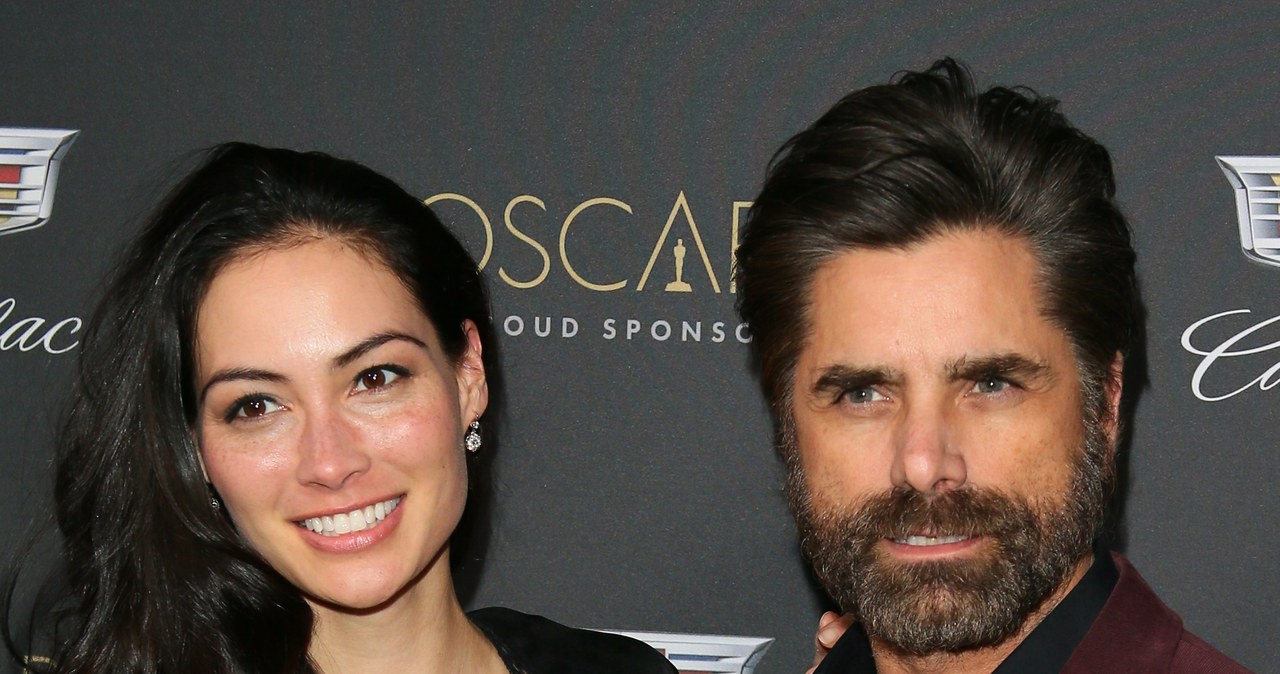 Caitlin McHugh, John Stamos /JB Lacroix/WireImage /Getty Images