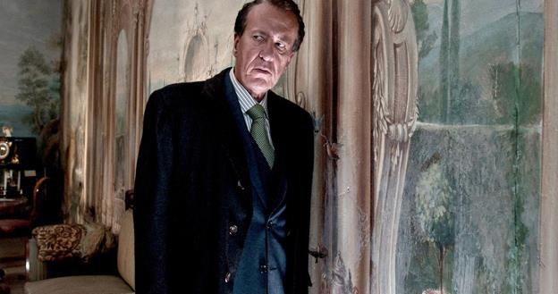 Geoffrey Rush w scenie z filmu "Koneser" /materiały dystrybutora