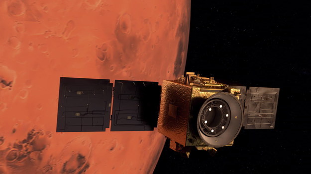 Ilustracja sondy i Marsa stworzona przez agencję kosmiczną Zjednoczonych Emiratów Arabskich /MBRSC/UAE Space Agency HANDOUT /PAP/EPA