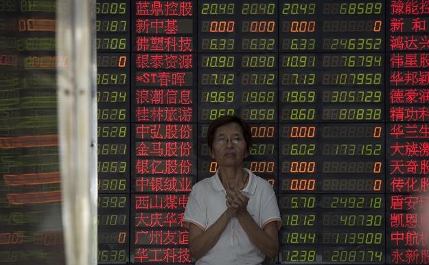 Inwestorzy spodziewają się - dewaluacja juana /AFP