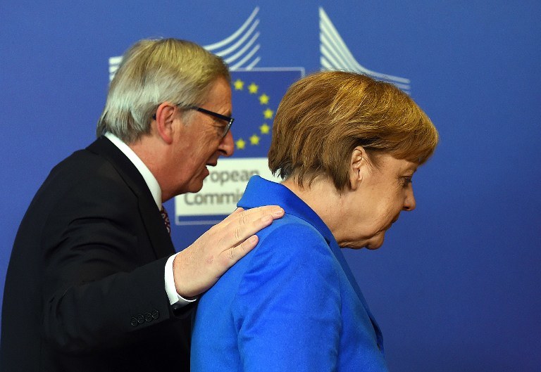 Jean Claude-Juncker i Angela Merkel /AFP