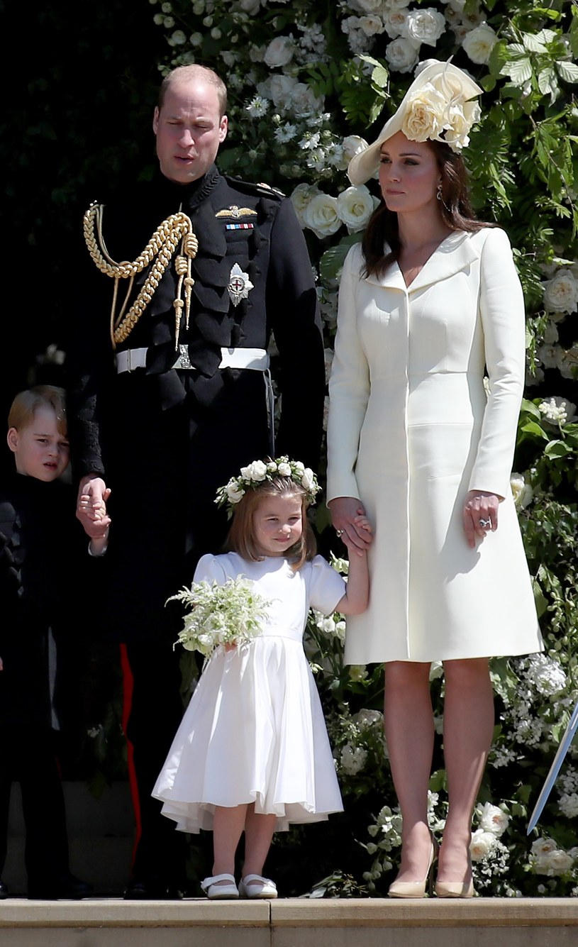 Księżna Kate i książę William z córeczką księżną Charlotte na ślubie Meghan Markle i księcia Harry'ego. /Jane Barlow / PA Images / Forum /East News