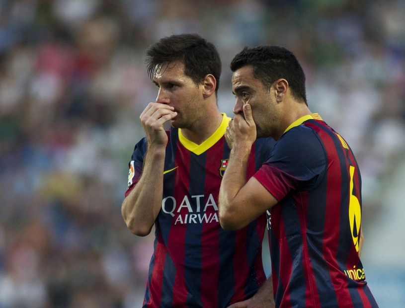 Leo Messi i Xavi /AFP