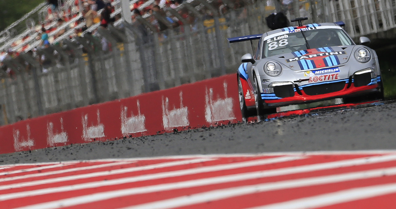 Loeb w Porsche /AFP