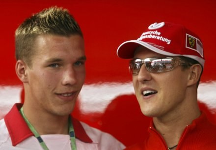 Lukas Podolski i Michael Schumacher /AFP