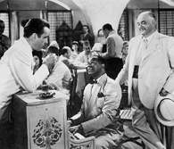 Michael Curtiz, kadr z filmu Casablanka. Na zdjęciu: Humphrey Bogart, Dooley Wilson, Sidney Greenst /Encyklopedia Internautica