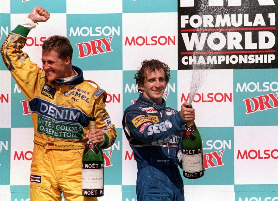 Michael Schumacher i Alain Prost cieszący się z miejsca na podium wywalczonego podczas Grand Prix Kanady w 1993 roku /JEFF HAYNES /PAP/EPA