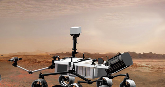 Mikro-pojazdy już od dawna penetrują powierzchnię Marsa. Kiedy pojawią się tam żywi ludzie? /AFP