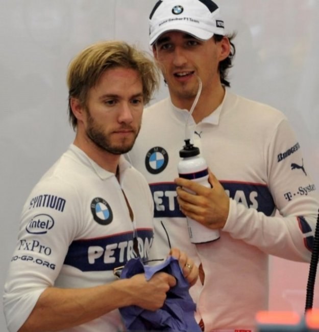 Nick Heidfeld (na pierwszym planie) stanowił z Robertem Kubicą duet kierowców BMW Sauber /AFP