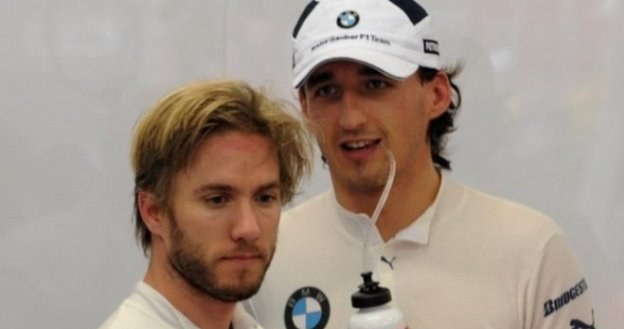 Nick Heidfeld (na pierwszym planie) stanowił z Robertem Kubicą duet kierowców BMW Sauber /AFP