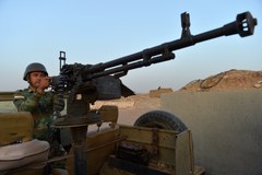 Peszmergowie na linii frontu wojny z IS