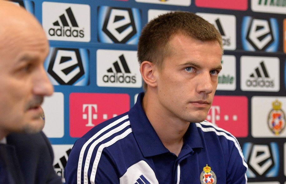 Prezes Wisły Kraków Jacek Bednarz i piłkarz "Białej Gwiazdy" Łukasz Burliga /Jacek Bednarczyk /PAP