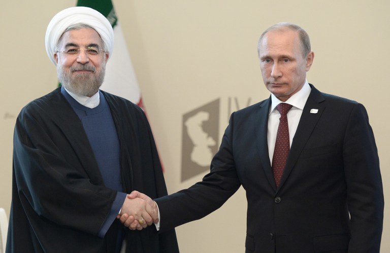 Prezydent Iranu Hassan Rouhani i Władimir Putin /AFP