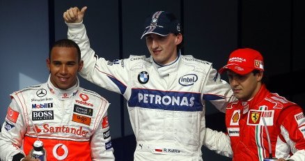 Robert Kubica w otoczeniu Hamiltona i Massy. /AFP