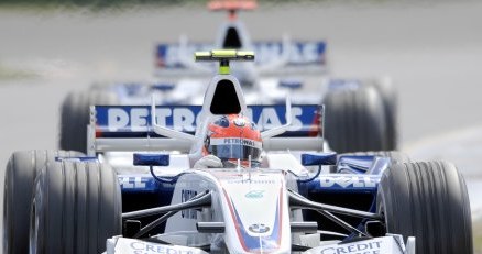 Robert Kubica, z tyłu Nick Heidfeld /AFP