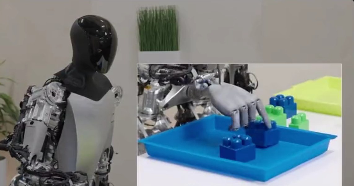 Robot Tesli lokalizuje klocki dzięki kamerom umieszczonym w dłoniach /Twitter