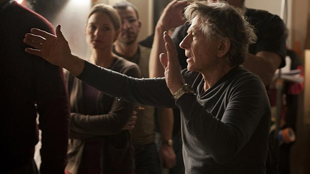 Roman Polański na planie filmu "Carnage". W tle m.in. Jodie Foster /materiały prasowe