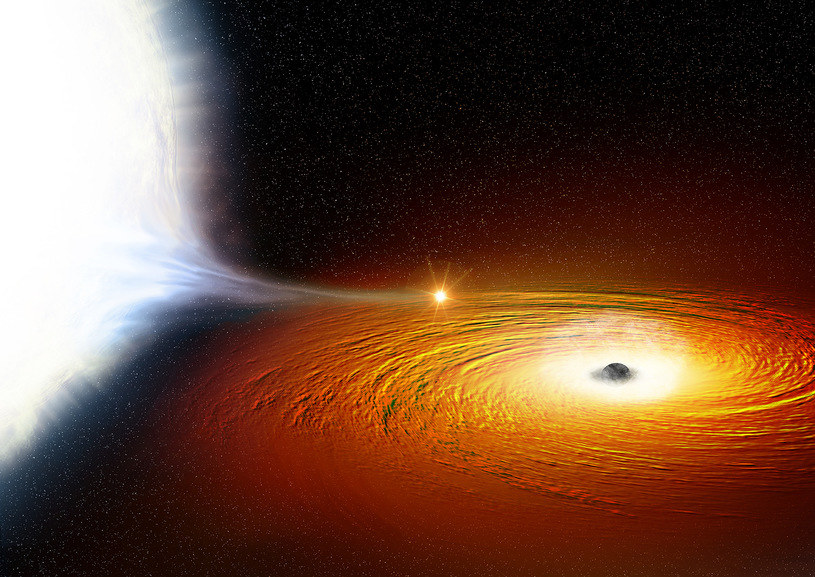 Rysunek obrazujący, jak biały karzeł (po lewej) krąży wokół czarnej dziury i stopniowo traci na jej rzecz swoją masę /NASA