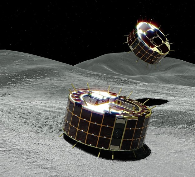 Rysunek pokazujący próbniki na powierzchni Ryugu, Rover-1A (w tle) i Rover-1B (na pierwszym planie) /JAXA /Materiały prasowe