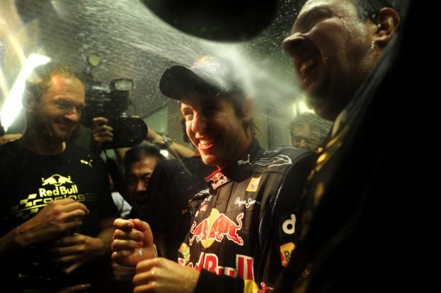 Sebastian Vettel skąpany w szampanie /AFP