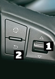 Skoda Układ przycisków typowy: obracając pokrętłem [1] wybieramy funkcje, akceptujemy je wciskając pokrętło, a wracamy - przyciskiem [2]. /Motor