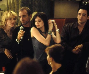 W filmie Mike'a Newella "Zmęczenie materiału" ekranową żoną Johna Cusacka była Cate Blanchett. Jego bohater miał do czynienia z małżeństwem granym przez prawdziwych małżonków: Billy'ego Boba Thorntona i Angelinę Jolie.