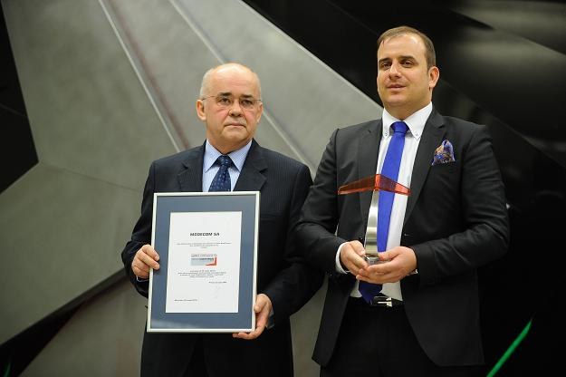 Waldemar Giersz (L), prezes MODECOM-u i przewodniczący nadzoru Jakub Łozowski (P) w czasie debiutu /PAP