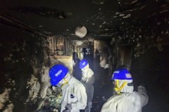 Zgliszcza po pożarze wieżowców w Hongkongu. Galeria